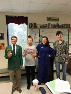McIntosh Students Connor Whittle, Katie Austensen, Kate Cullen, and Preston Pitts pose before the opening question of their mock debate.