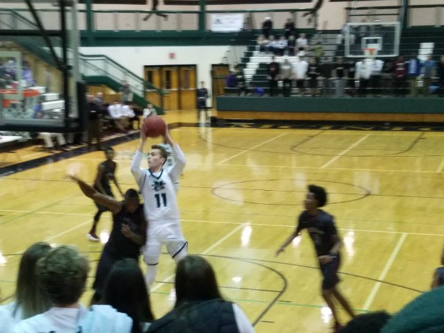 Senior William Stowman drives in for a layup.