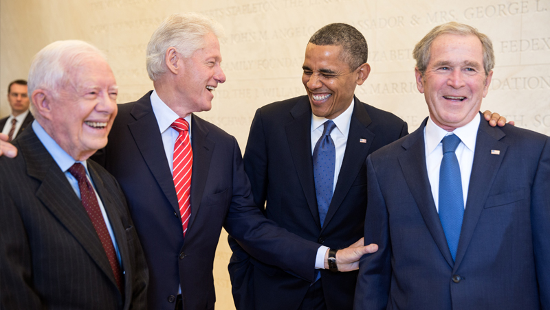 Former Presidents share a joke.
