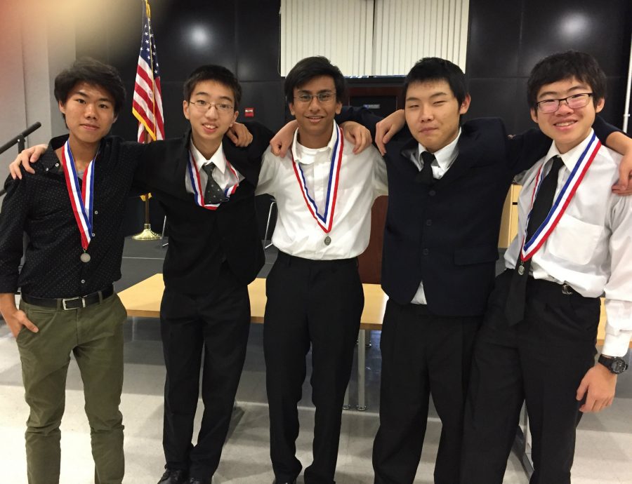 Students+Joon+Baek%2C+Mark+Ni%2C+Man+Shah%2C+James+Wong%2C+and+Jonathan+Zhang+won+second+place+after+competing+in+the+quiz+bowl+competition.+