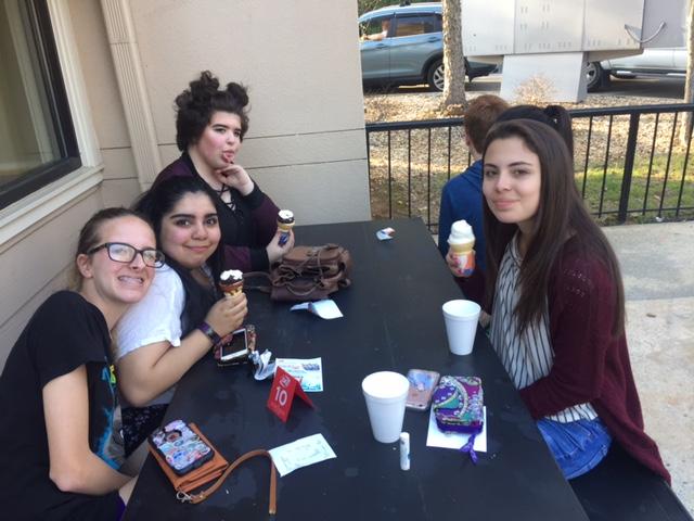 McIntosh students Ana Flores, Claire Oliver, and Raquel Baston enjoy the first day of spring with free treats.