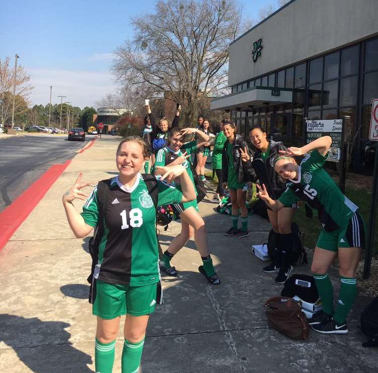 The girls team prepares for their game against the Wildcats.