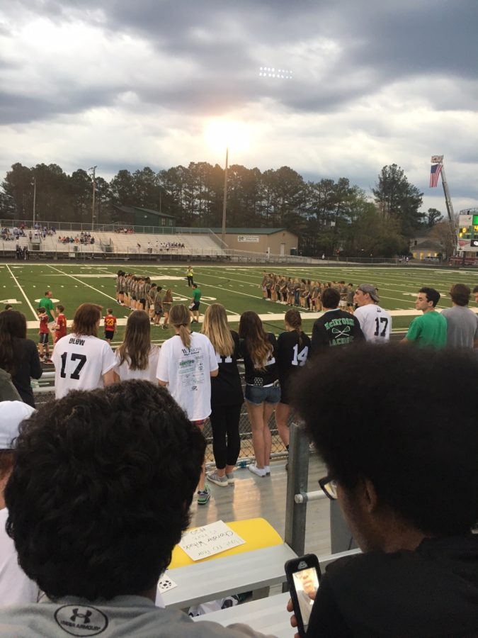 In between the girls, and guys, varsity games, freshmen and JV teams line the field to honor those who have served. 