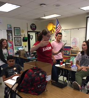 Student Chief Editor Sophie Roggermeier reads one of her own poems from this years edition of MisChief to the other students.