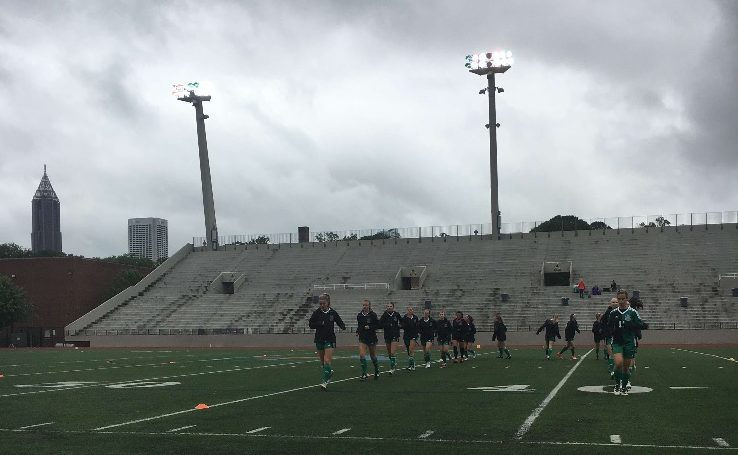 The Lady Chiefs warm up at Grady High School before competing in the elite 8 game to advance into semi-finals.