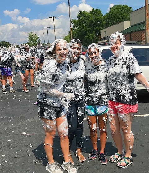 Seniors (left to right) Abby Burke, Tiffany Netto, Caroline Chang, and Kristen Ford are casualties of the senior shaving cream war.