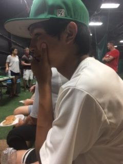 Players wait out rain delay during baseball banquet.