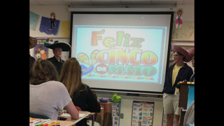 Students wear hats and sing in honor of the holiday.