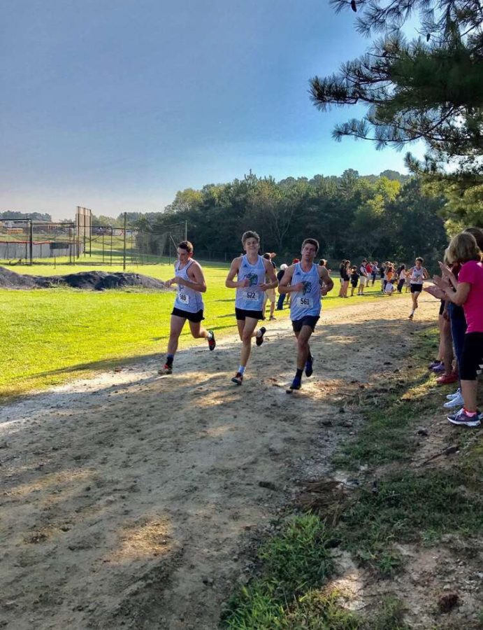 Garrett and three teammates finishing one of their last races.