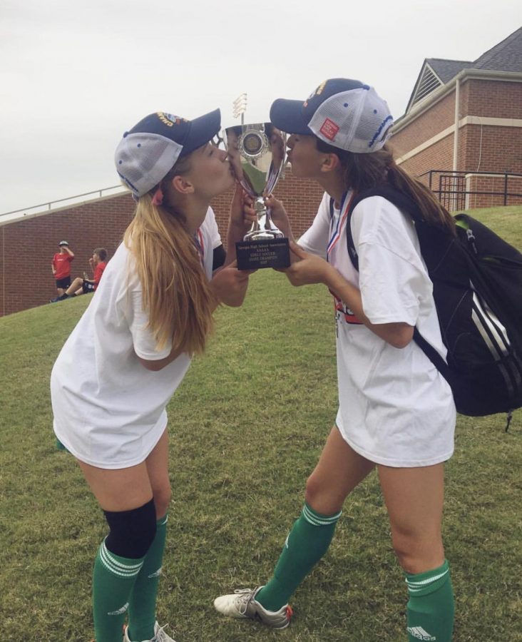 Former Lady Chief captain Chandler Witucki(left) and senior Hannah Ellison celebrating their 2017 state championship win.