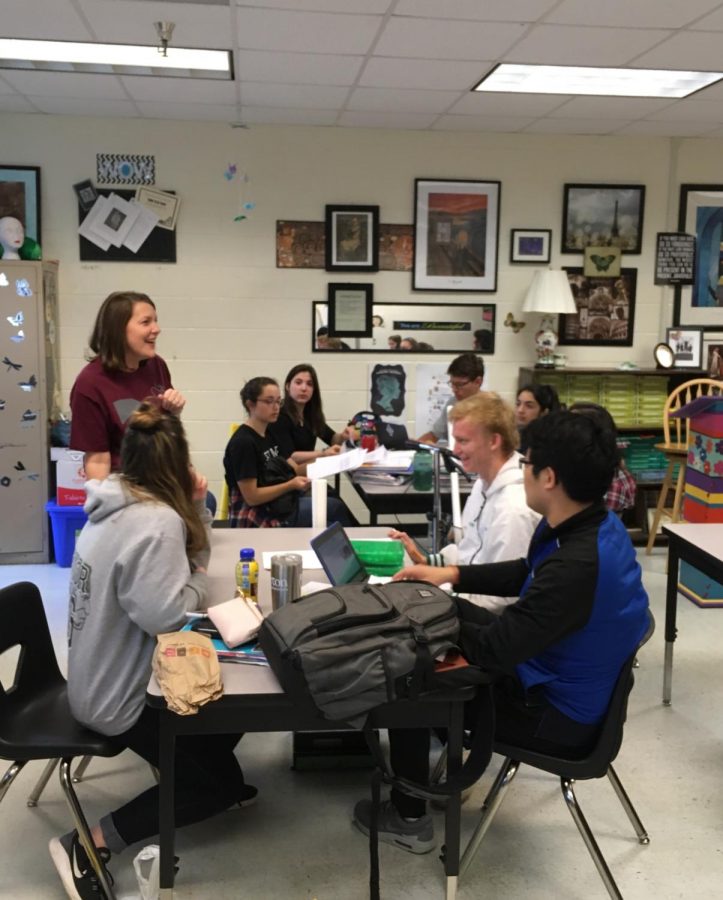 Ms. Walls jokes with her AP Literature class about their end-of-the-year projects.