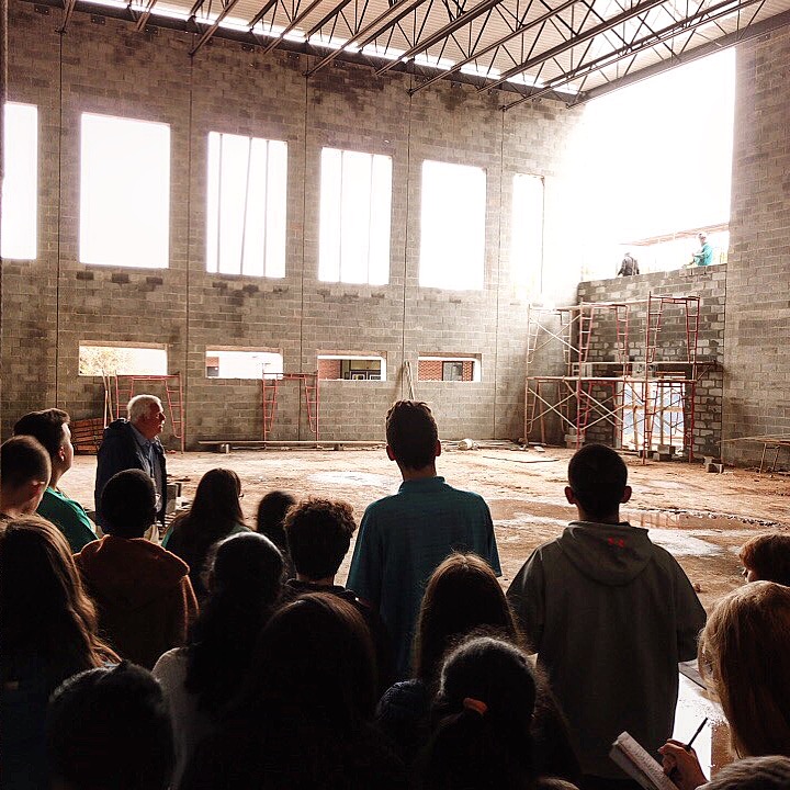 STEM students take a tour through the skeleton of the soon-to-be Multi-purpose room.  Image by Seth Bishop