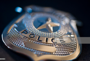 The police badge picture is a photo supplied by Getty Images. 