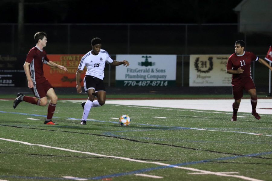 Baba Agbaje takes on defender during past game against Whitewater.