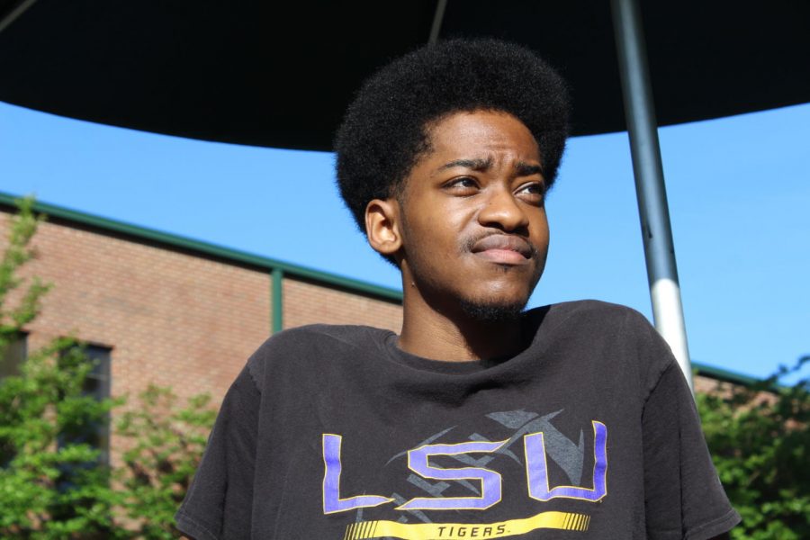 Senior Jermal Hall, McIntosh Trail staff member, poses in his Louisiana State University shirt.