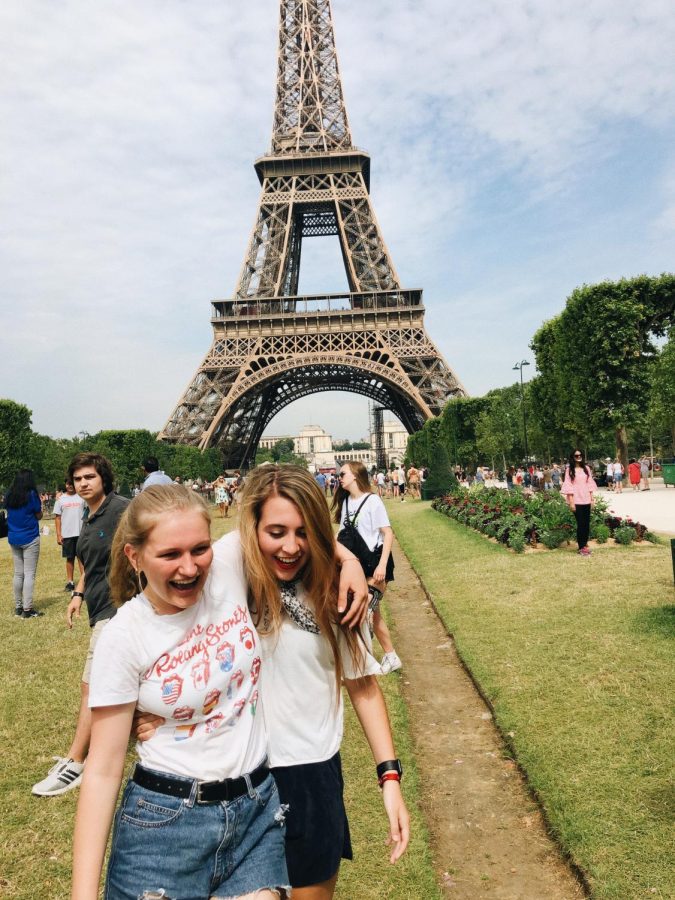 Junior Brooke Boucher (left) and senior Ava Kreitner (right) enjoy their time in Paris in front of the Eiffel Tower.