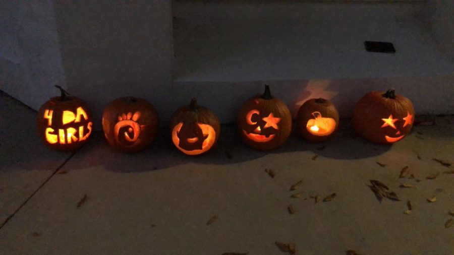 Seniors Ava Kreitner, Emily Johnfore, Morgan Love, Karmen Beaver and Samantha Cornett carved pumpkins as a part of their halloween activities. 