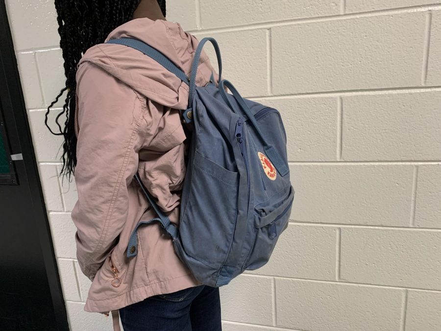 Popular backpacks such as these are used despite the no backpack policy.  