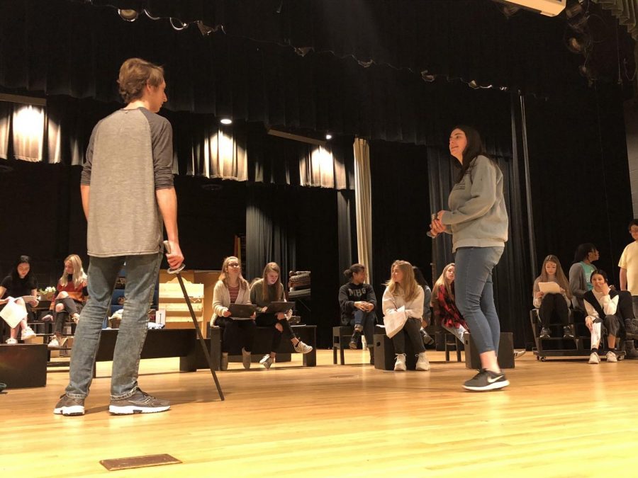 Seniors Sullivan Dawson and Eva Berger practice the final battle in Macbeth before their performance.