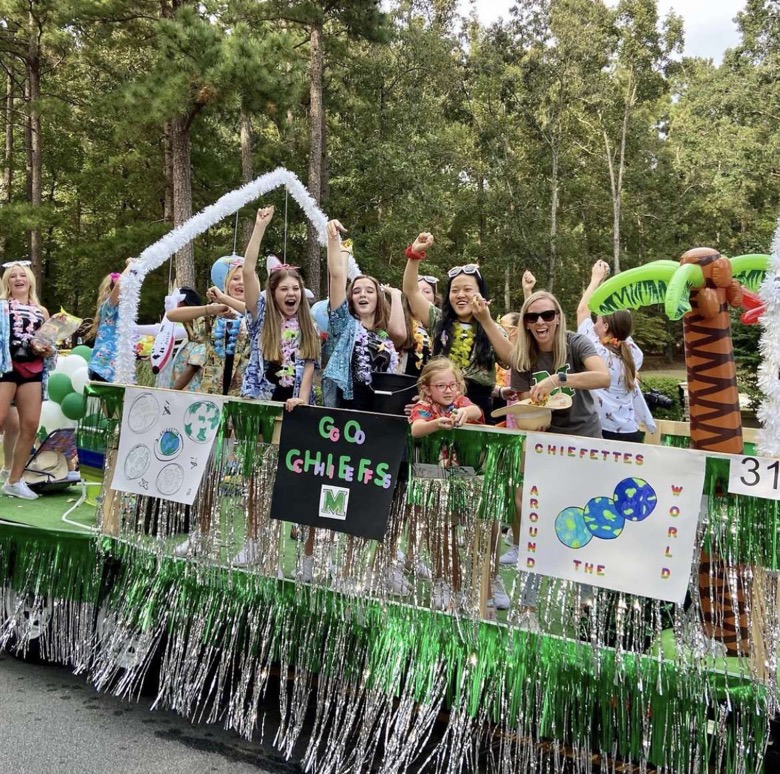 Chiefettes cheer on and show spirit to those around them on around the world float. Photo submitted by Olivia Anderson
