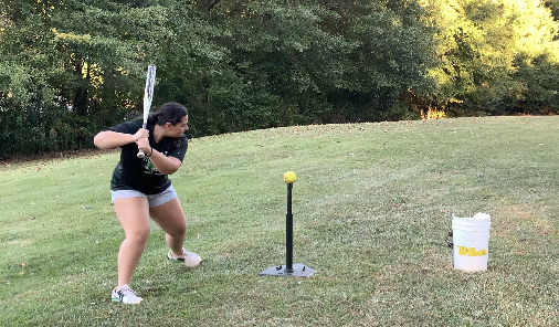 Sanchez practicing softball in her backyard
