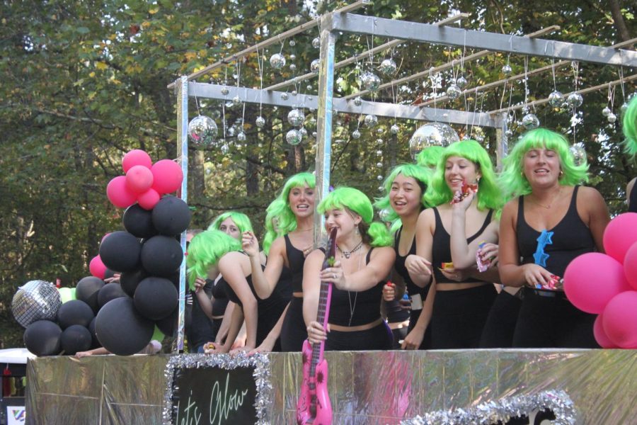 The MHS Chiefettes followed the theme of Glow the Night Away with neon wigs on their Homecoming parade float.