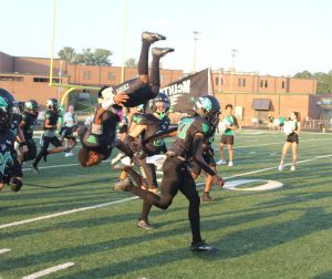 Senior RB Mason Green backflips his way out of the run through at the start of the Aug. 18 game against Fayette County HS. The Chiefs won the third consecutive Fight for 54 37-24.