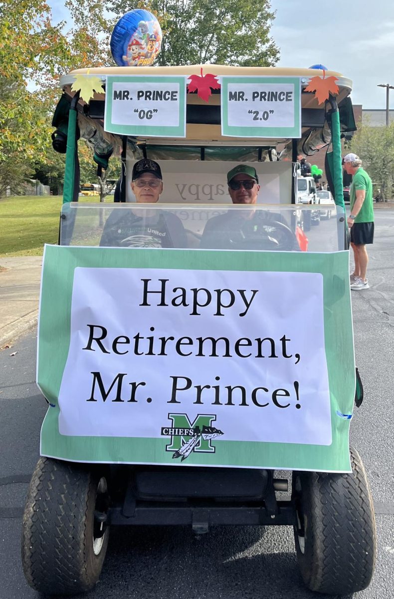 Jerry Prince and Stan Ledford (current parking lot attendant) at the front of the Homecoming Parade in honor of Princes retirement. 