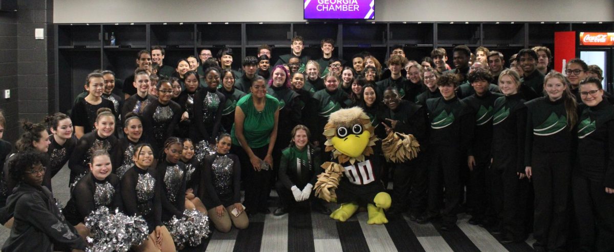 The Spirit of McIntosh poses for a photo with Freddie Falcon after their performance. Photo courtesy of Camilla OConnell