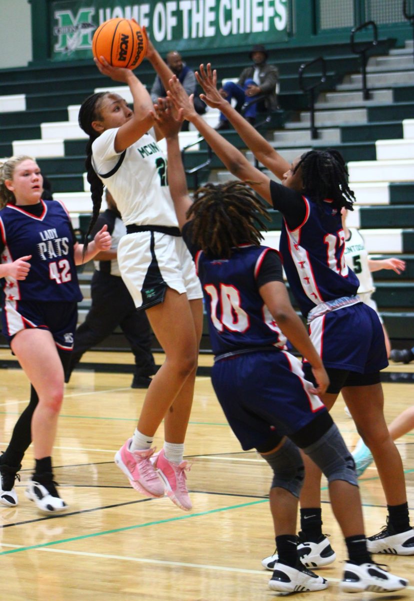 Senior Kendall Davis attempts to make a basket. Davis ranks third all time in scoring for female McIntosh basketball players. 
