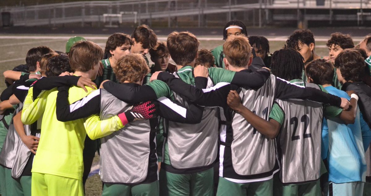 Boy+soccer+team+huddle+during+the+Feb.+13+game+against+Clarkston.