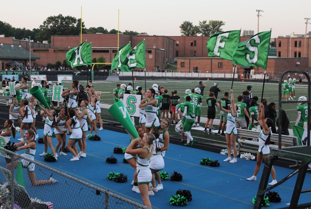 McIntosh Varsity Cheer performing at the Sandy Creek game on Aug. 23.