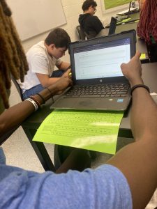 LaQuan Shuler, a sophomore at McIntosh High School on his new Chromebook.