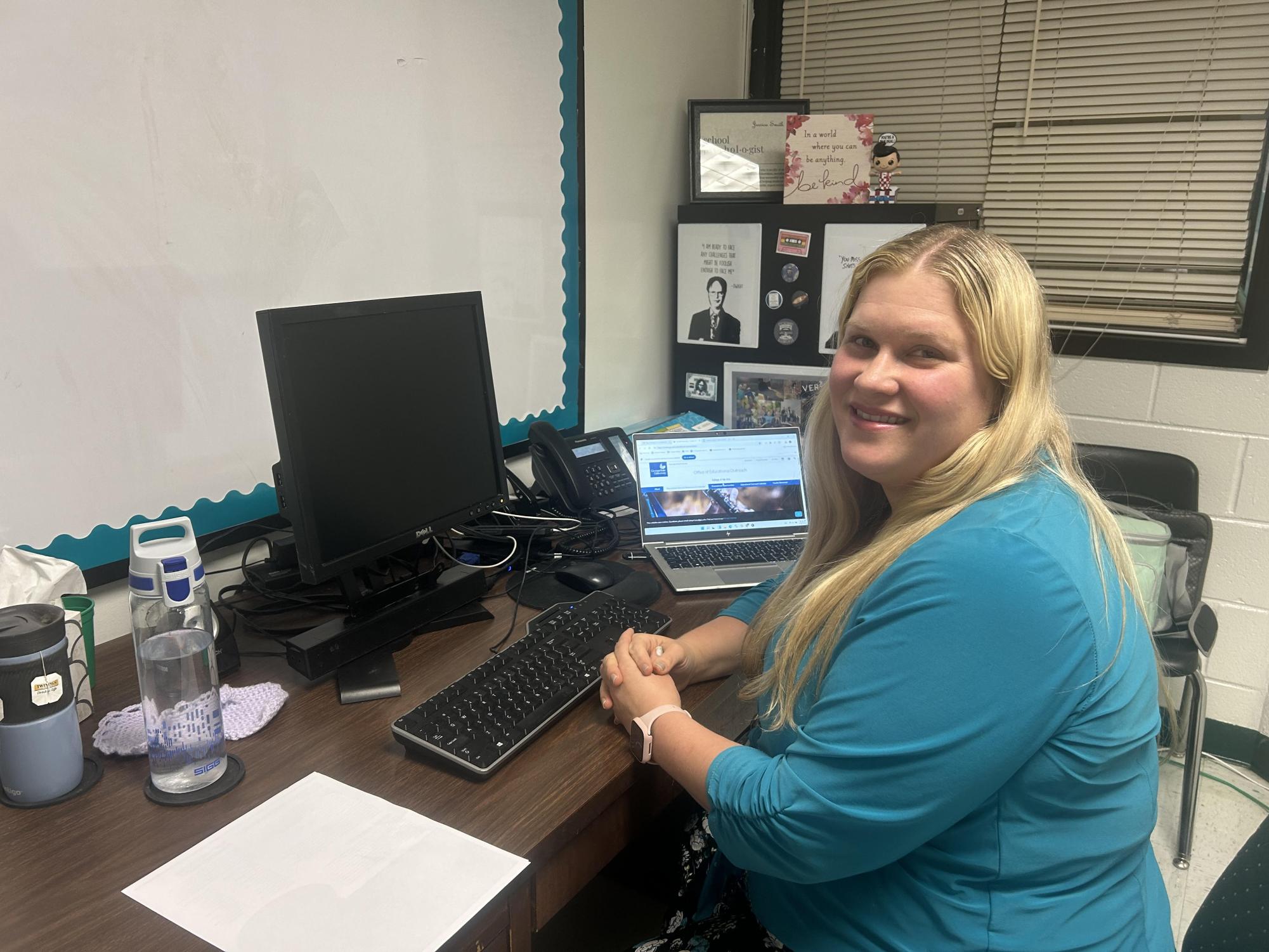 School psychologist Jessica Smith sitting at her desk in her office.