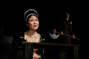 Anne Boleyn played by Yui Otsuga (12) praying to god, before her execution, while her executioner, Karina Nirenberg (12) wait behind her.