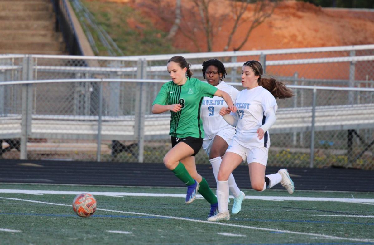 Sophomore defender, Caroline Willis, rushes to the ball at the Lovejoy game on March 6. Photo by Grace Lovejoy.