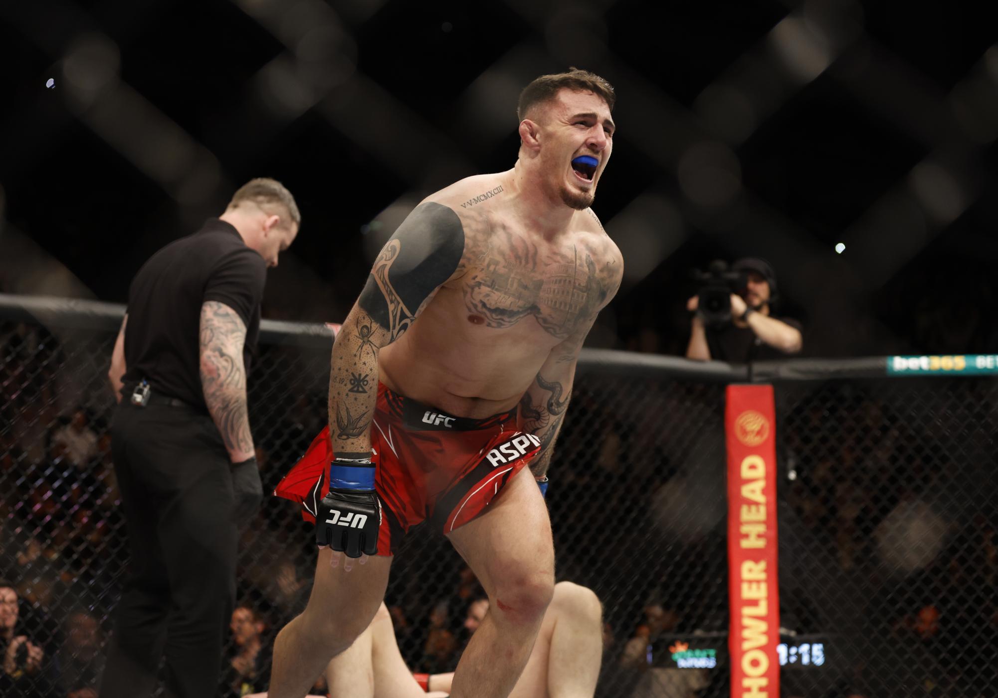 Mixed Martial Arts - UFC - Alexander Volkov v Tom Aspinall - O2 Arena, London, Britain - March 19, 2022 Tom Aspinall celebrates winning his fight against Alexander Volkov Action Images via Reuters/Peter Cziborra