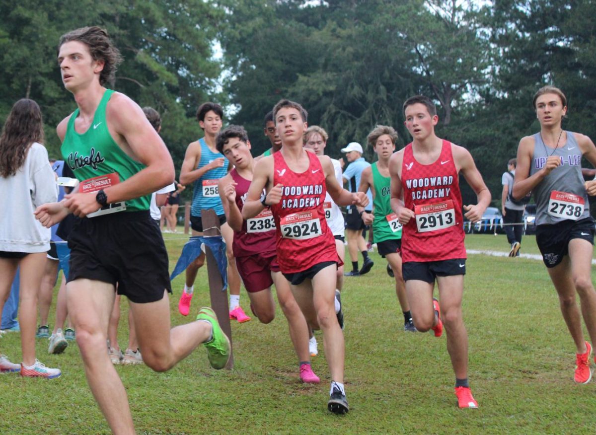 Junior Jace Moffett, running in the Boys Varsity 5000 meter race.