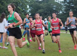 Junior Jace Moffett, running in the Boys Varsity 5000 meter race.