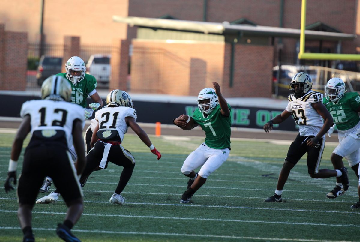 Freshman, Cahmar Smith-Ellis, dodges a tackle from Fayette County. 