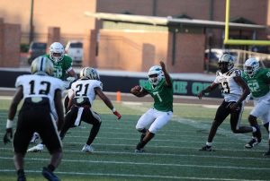 Freshman, Cahmar Smith-Ellis, dodges a tackle from Fayette County. 
