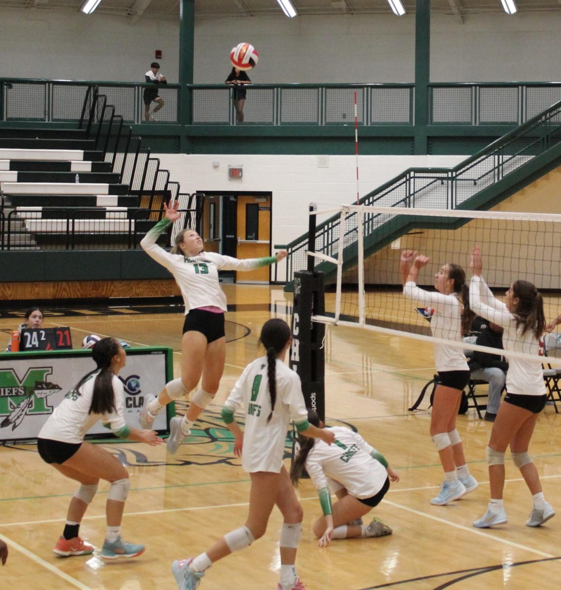 Outside and opposite hitter, Claudia Meditz (12), gets ready to score match point against Midtown high school.