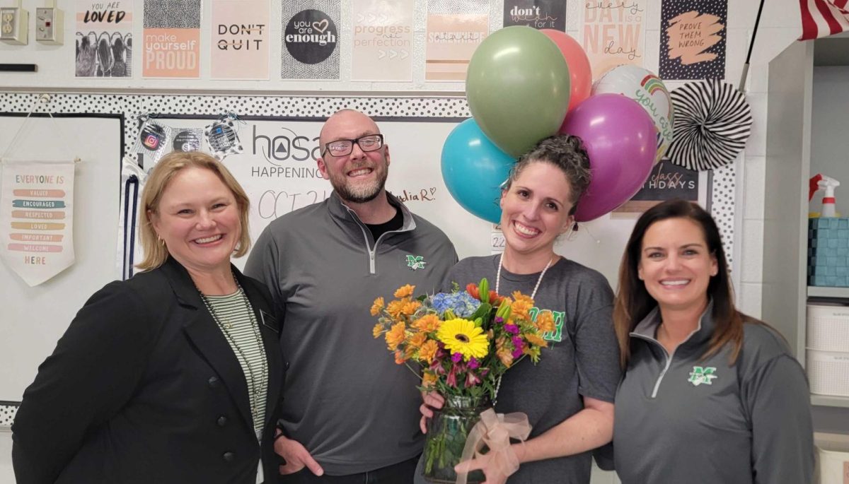 Principal Amy Hammock, Assistant Principal Bob Rice, TOTY Healthcare teacher Jacqueline Burgess, Assistant Principal Nicole Guest. Photo courtesy of McIntosh High School. 
