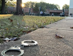 Photo of handcuffs in the McIntosh courtyard symbolizes repression in secrecy.
