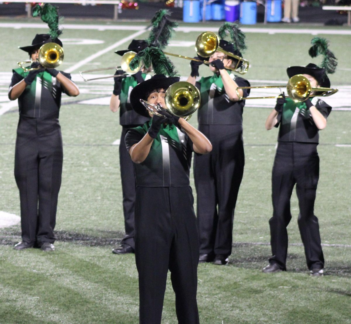 McIntosh Marching band trombone players on the football field playing during the game on October 3rd.