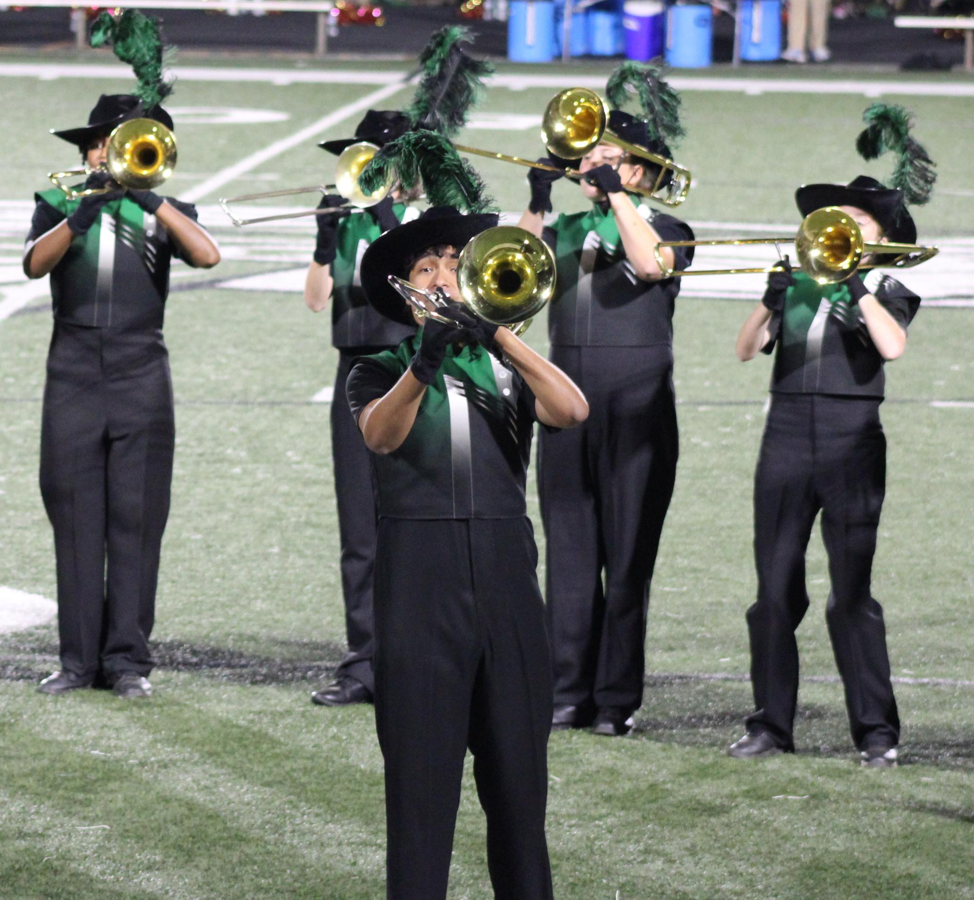 McIntosh Marching band trombone players on the football field playing during the game on October 3rd.