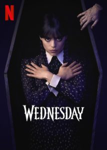Wednesday Addams poses inside a coffin for the Netflix series "Wednesday".