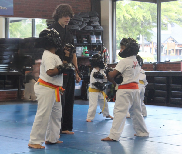 McIntosh senior Noah Field instructing elementary students at Championship Martial Arts. 