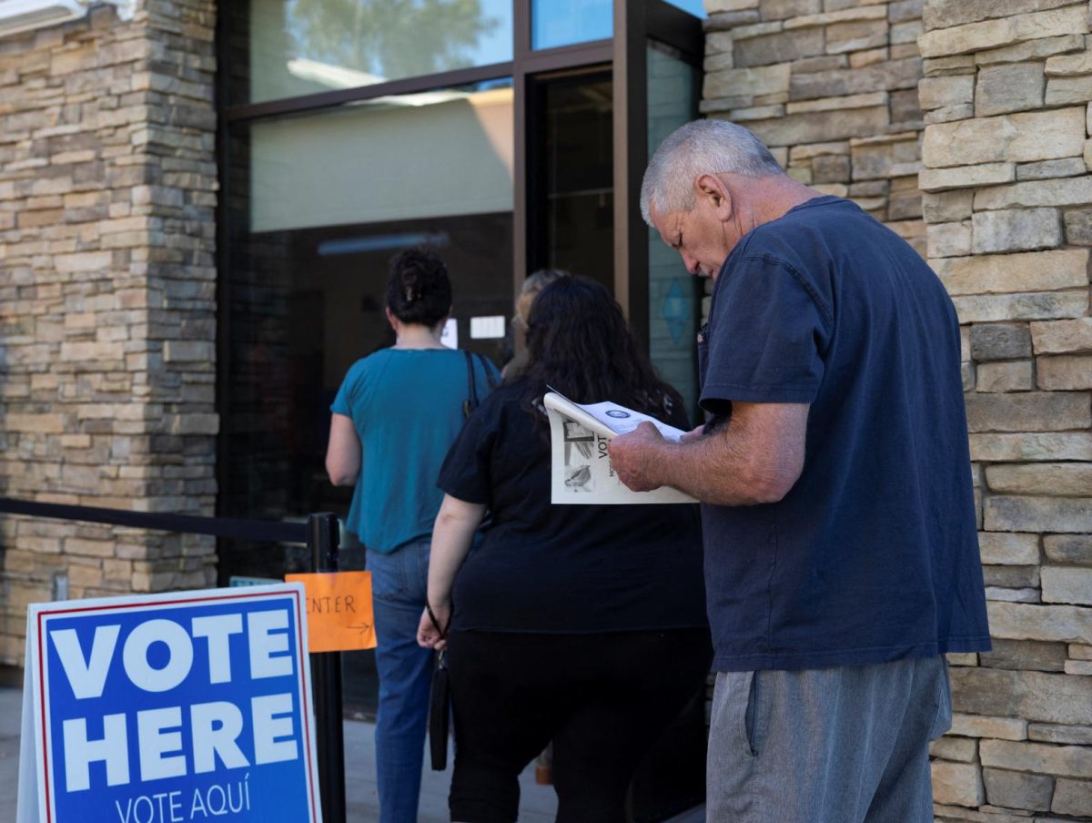 Voters line up to vote in Califonia's special election for Proposition 50, a measure that would temporarily redraw congressional districts, in Romona, California, U.S., November 4, 2025.  REUTERS/Zoe Meyers