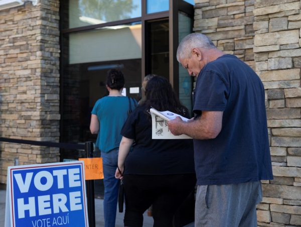Voters line up to vote in Califonia's special election for Proposition 50, a measure that would temporarily redraw congressional districts, in Romona, California, U.S., November 4, 2025. REUTERS/Zoe Meyers